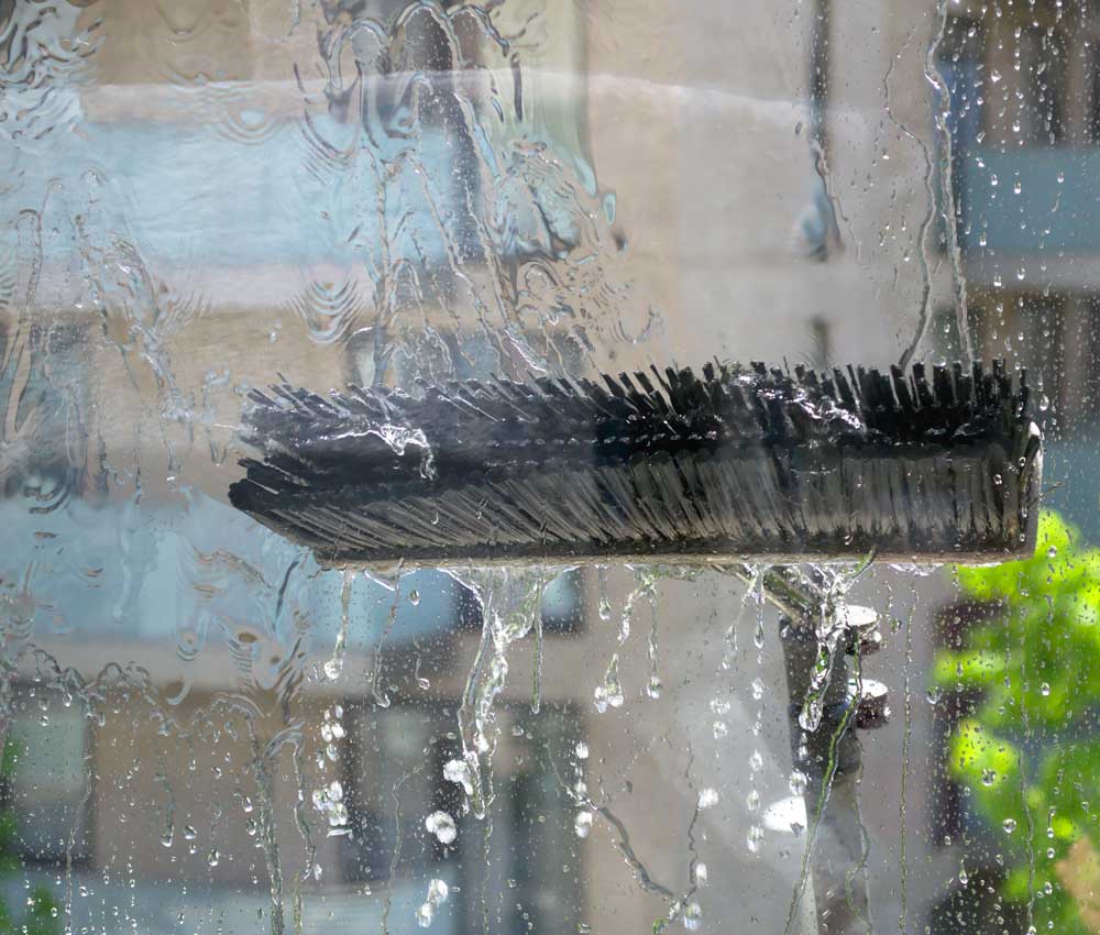 Our Window Washing Uses Water-Fed Poles To Leave Your Windows Spotless